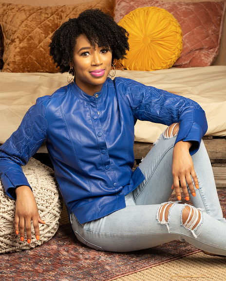 woman wearing SESS RAY blue leather jacket with distressed jeans