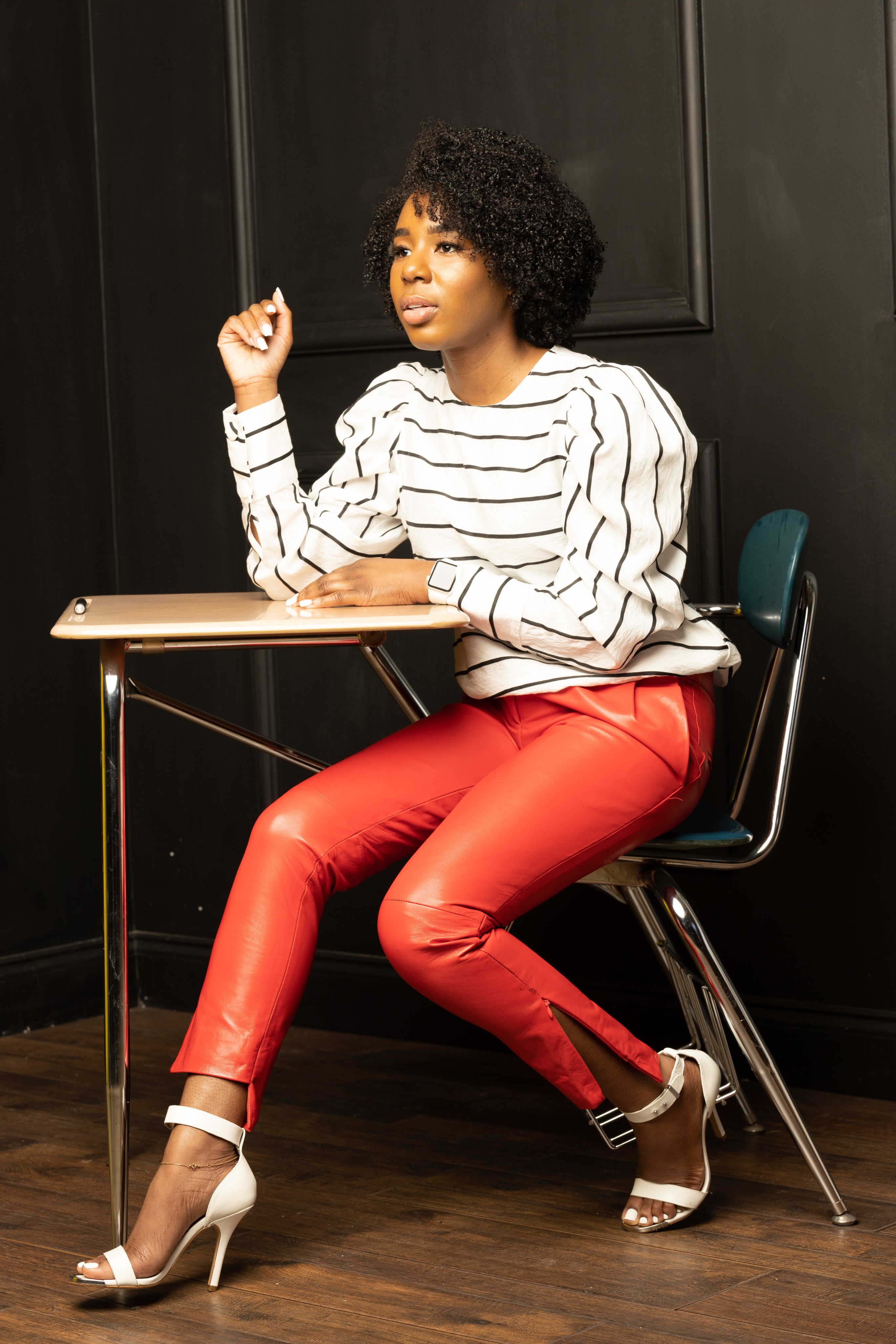 woman wearing SESS RAY red leather pants with a blouse